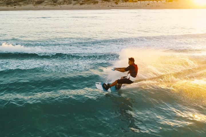 a man riding a wave on a surfboard in the water