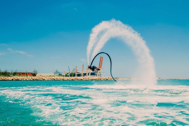 person doing flips whilst flyboarding