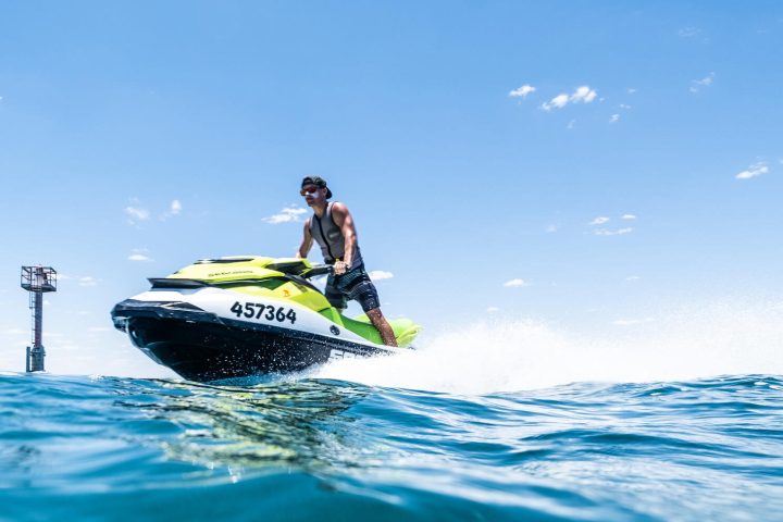 a man riding a wave on a surfboard in the water