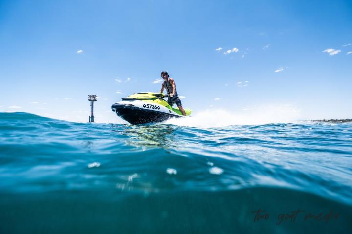 a man riding a wave on a surfboard in the water