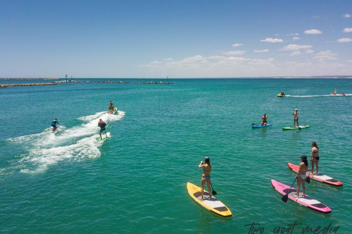 a group of people in a large body of water