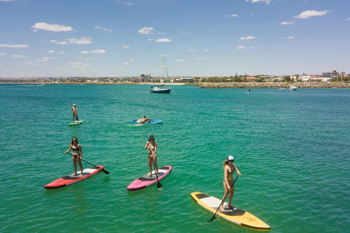 a group of people on a boat in a body of water