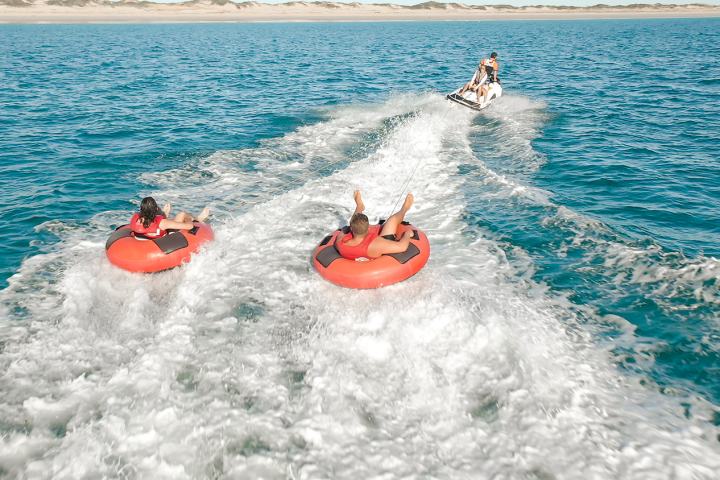 a person riding a wave on top of a body of water