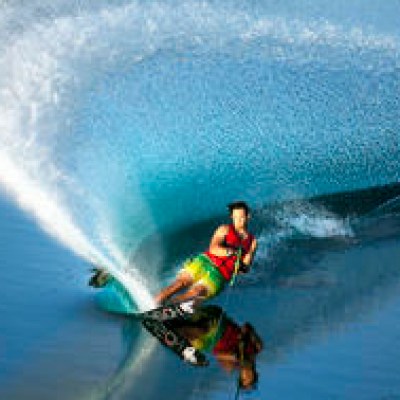 a man riding a wave on top of a body of water
