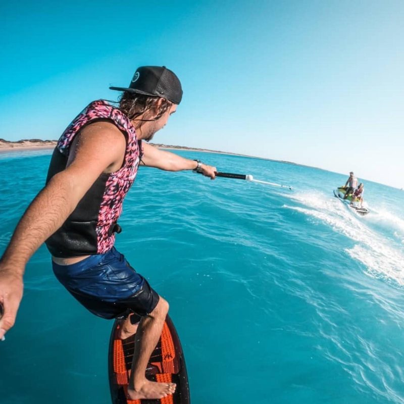 a person riding a surf board in the water